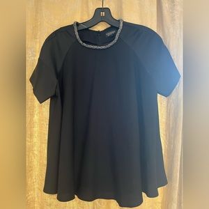 Festive holiday swing blouse. Black polyester with beaded collar.